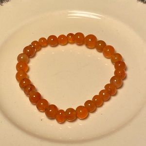 Unisex rare orange agate stretch elastic bracelet.